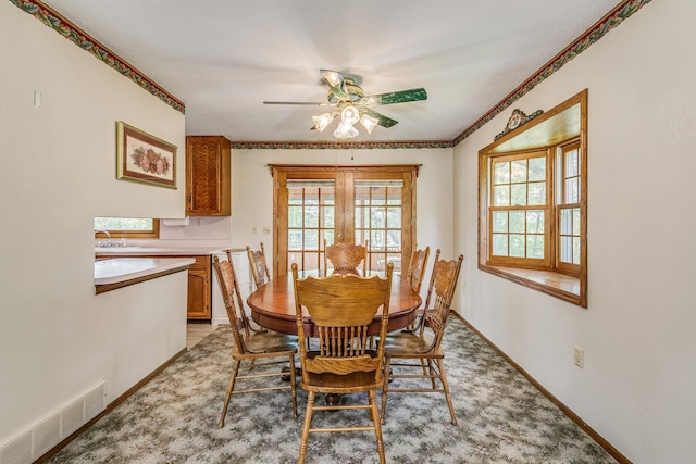 10275 Park Cir, Pine City, MN 55063 - dining space with a ceiling fan, baseboards, and light colored carpet