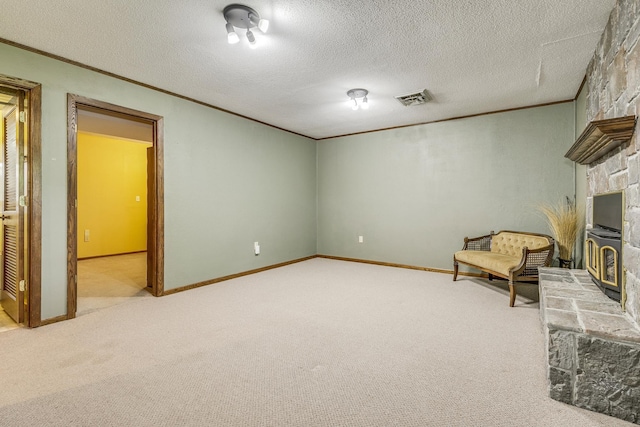 10275 Park Cir, Pine City, MN 55063 - unfurnished room with ornamental molding, carpet flooring, a textured ceiling, baseboards, and a fireplace