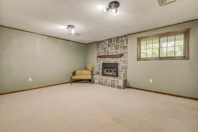 10275 Park Cir, Pine City, MN 55063 - unfurnished living room with a textured ceiling, a fireplace, baseboards, carpet, and crown molding