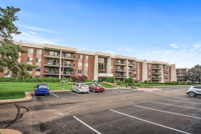 2455 Londin Ln E Unit 216, Maplewood, MN 55119 - view of apartment building / complex featuring uncovered parking