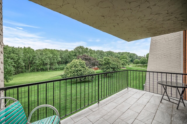2455 Londin Ln E Unit 216, Maplewood, MN 55119 - balcony featuring a forest view