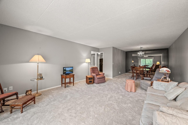 2455 Londin Ln E Unit 216, Maplewood, MN 55119 - living room featuring a chandelier, carpet, and a textured ceiling