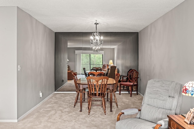 2455 Londin Ln E Unit 216, Maplewood, MN 55119 - dining area with carpet flooring, a chandelier, and a textured ceiling