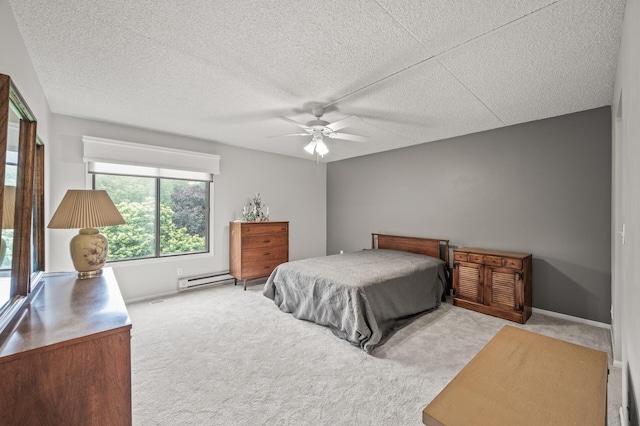 2455 Londin Ln E Unit 216, Maplewood, MN 55119 - bedroom with carpet, baseboard heating, a textured ceiling, and a ceiling fan