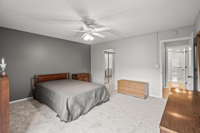 2455 Londin Ln E Unit 216, Maplewood, MN 55119 - bedroom featuring carpet floors, a ceiling fan, and a textured ceiling
