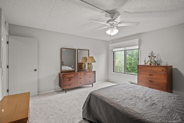 2455 Londin Ln E Unit 216, Maplewood, MN 55119 - bedroom featuring carpet, a textured ceiling, and a ceiling fan