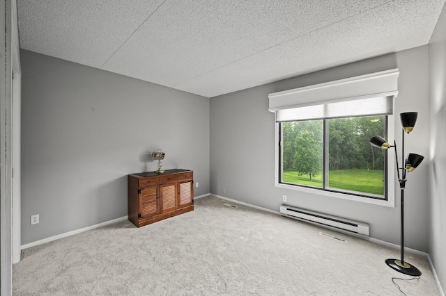 2455 Londin Ln E Unit 216, Maplewood, MN 55119 - unfurnished bedroom with baseboard heating, carpet flooring, and a textured ceiling