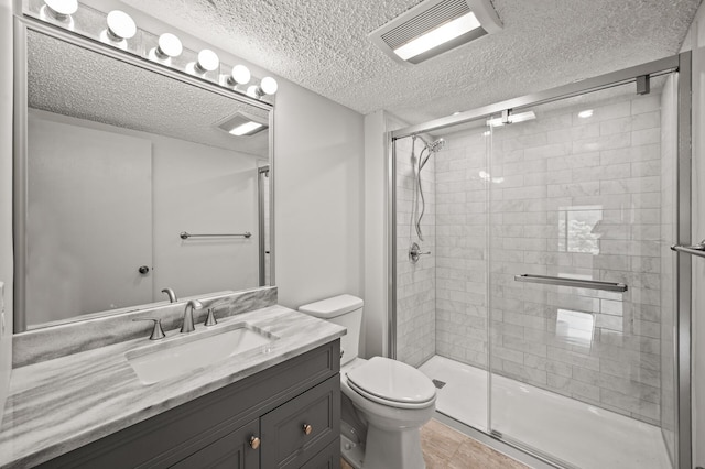 2455 Londin Ln E Unit 216, Maplewood, MN 55119 - bathroom with vanity, a textured ceiling, and a shower stall