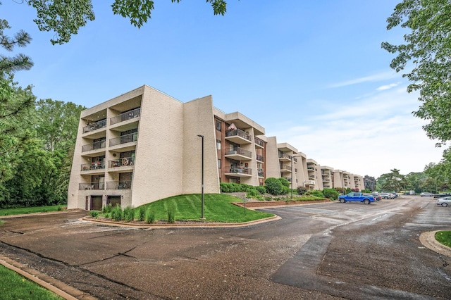 2455 Londin Ln E Unit 216, Maplewood, MN 55119 - view of apartment building / complex with uncovered parking
