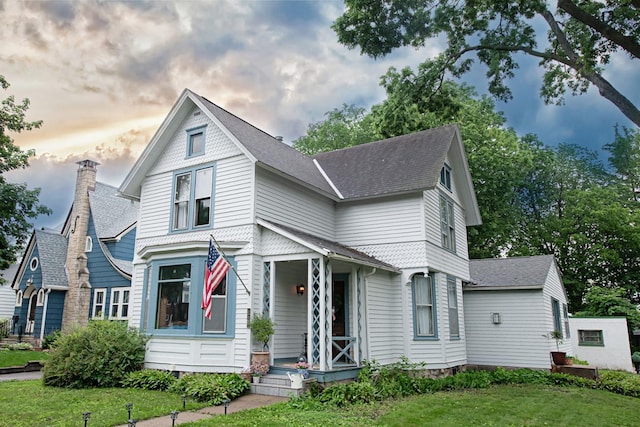 72 Mill St, Winona, MN 55987 - victorian-style house with a shingled roof and a lawn