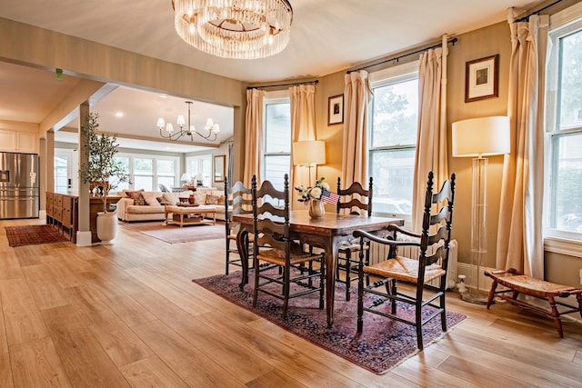 72 Mill St, Winona, MN 55987 - dining room with a chandelier and light wood-type flooring