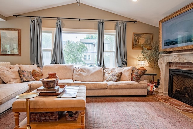 72 Mill St, Winona, MN 55987 - living area featuring vaulted ceiling and a brick fireplace