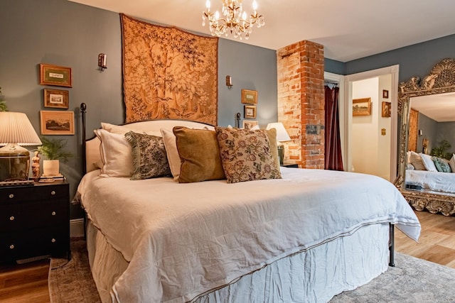72 Mill St, Winona, MN 55987 - bedroom featuring wood finished floors and a chandelier
