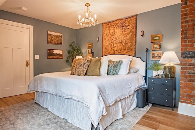 72 Mill St, Winona, MN 55987 - bedroom featuring wood finished floors and a chandelier