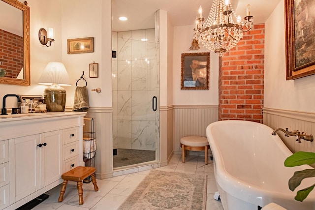 72 Mill St, Winona, MN 55987 - bathroom featuring marble finish floors, a wainscoted wall, a shower stall, a chandelier, and vanity