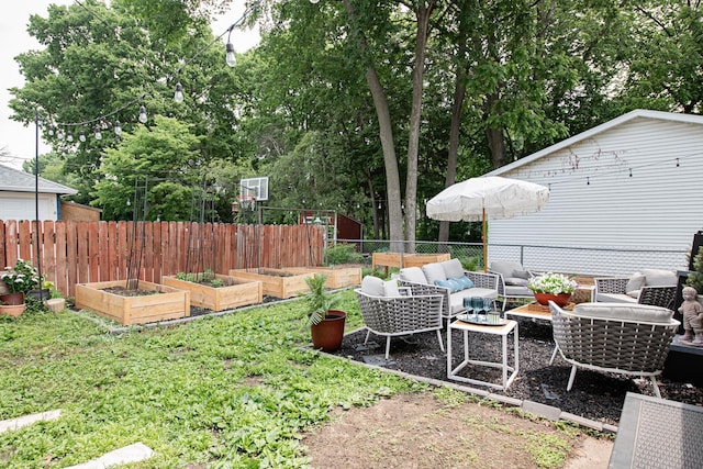 72 Mill St, Winona, MN 55987 - view of yard featuring a garden and an outdoor hangout area
