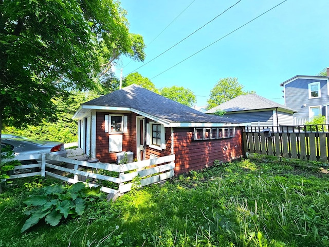 214 Vasa Ave, Fergus Falls, MN 56537 - rear view of house featuring a shingled roof