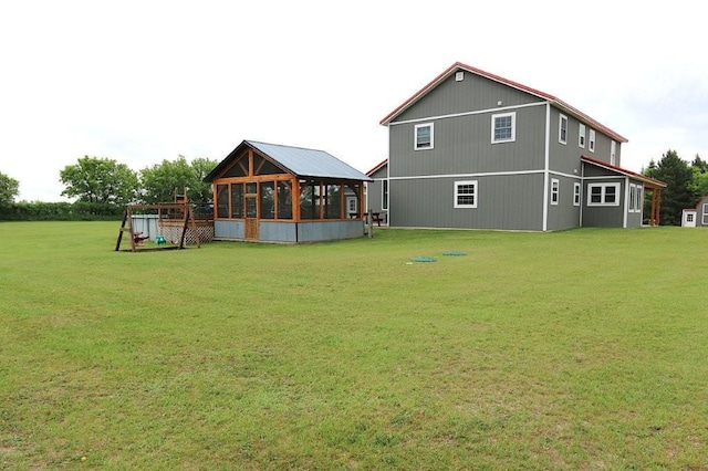 39192 460th Ave, Perham, MN 56573 - rear view of property with a yard and a sunroom