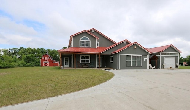 39192 460th Ave, Perham, MN 56573 - view of front of home with a barn, an attached garage, concrete driveway, a front yard, and an outbuilding