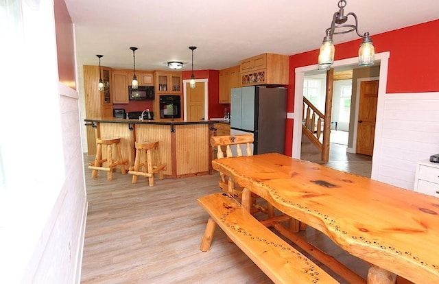 39192 460th Ave, Perham, MN 56573 - dining area featuring light wood-style flooring and stairway