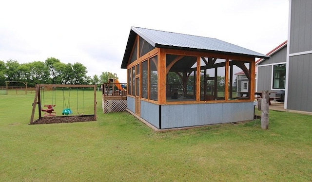 39192 460th Ave, Perham, MN 56573 - view of home's exterior featuring a sunroom and a yard