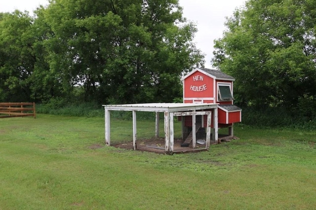 39192 460th Ave, Perham, MN 56573 - view of yard featuring exterior structure, an outdoor structure, and view of wooded area