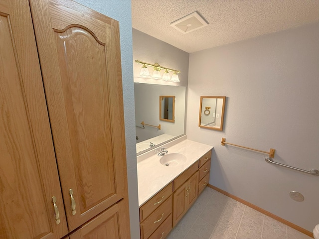 1423 Fairview Ln, Little Falls, MN 56345 - bathroom featuring vanity, a textured ceiling, and tile patterned floors