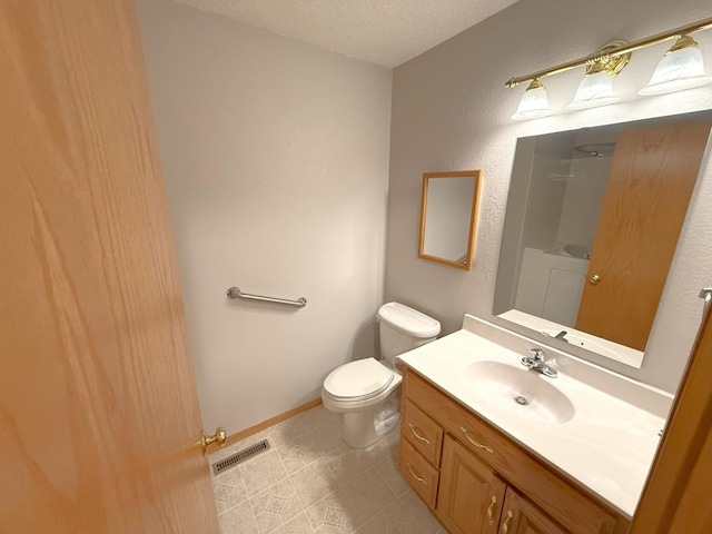 1423 Fairview Ln, Little Falls, MN 56345 - bathroom featuring a textured ceiling, vanity, and a shower