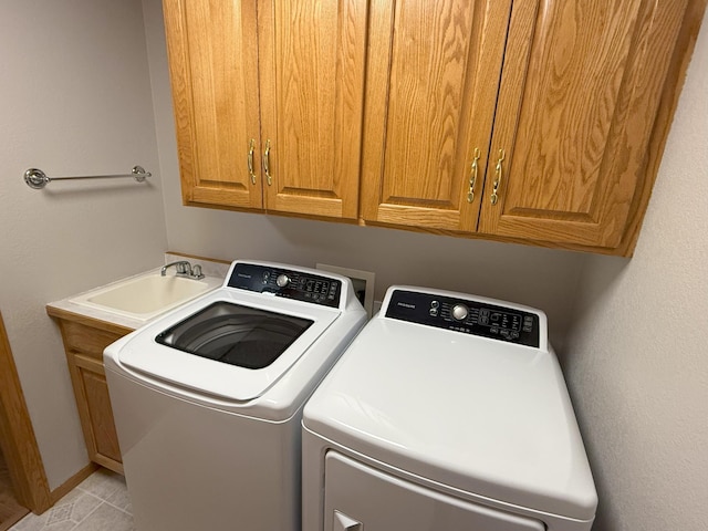 1423 Fairview Ln, Little Falls, MN 56345 - washroom with washer and clothes dryer, cabinet space, and light tile patterned flooring