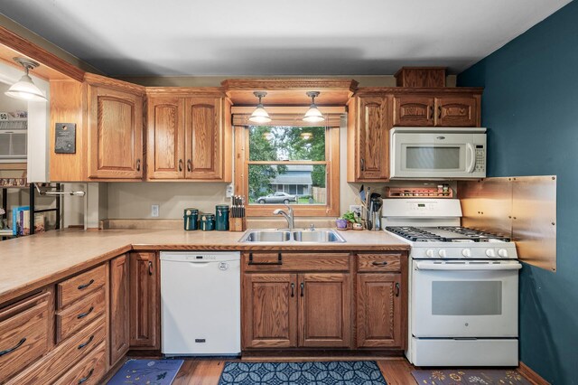 677 Quinnell Ave N, Lakeland, MN 55043 - kitchen featuring white appliances, a sink, wood finished floors, light countertops, and brown cabinets