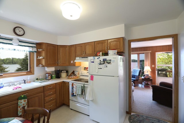 3883 Pleasant Ln, Fayal Twp, MN 55734 - kitchen featuring white appliances, under cabinet range hood, brown cabinets, light countertops, and open shelves