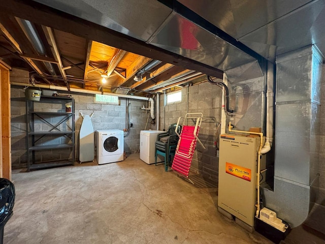 3883 Pleasant Ln, Fayal Twp, MN 55734 - below grade area featuring washing machine and clothes dryer and heating unit