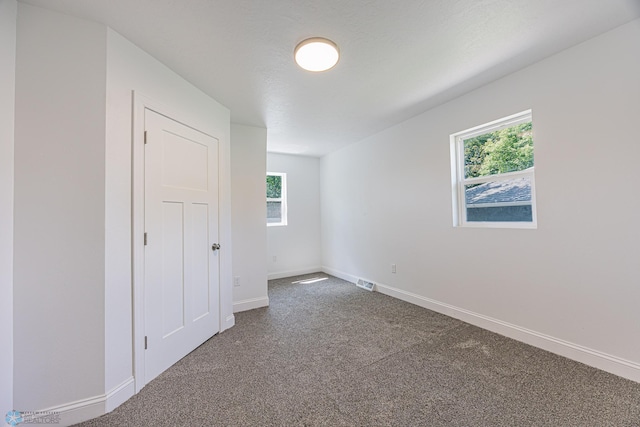 1814 5th St N, Fargo, ND 58102 - carpeted empty room featuring healthy amount of natural light and baseboards