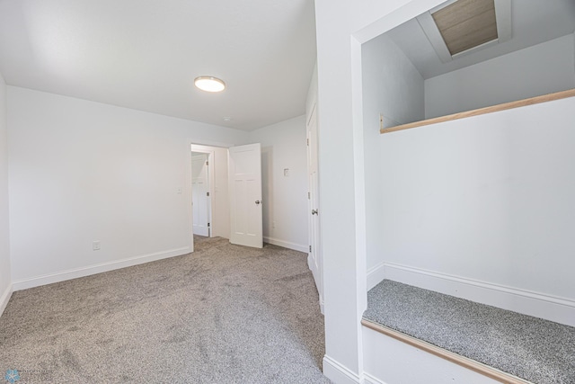 1814 5th St N, Fargo, ND 58102 - carpeted empty room featuring attic access and baseboards