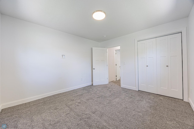 1814 5th St N, Fargo, ND 58102 - unfurnished bedroom featuring carpet floors, baseboards, and a closet