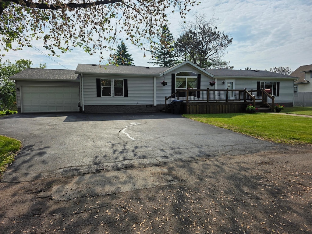 916 Spring Lake Rd, Cloquet, MN 55720 - manufactured / mobile home featuring driveway, a garage, a front yard, a wooden deck, and crawl space