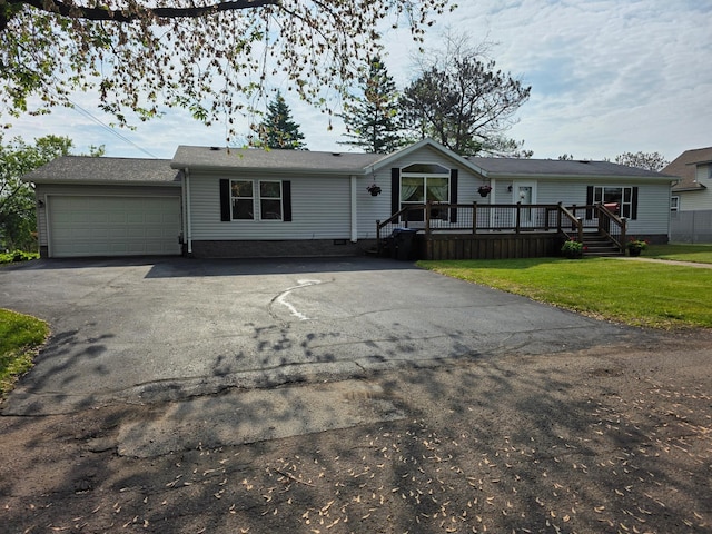 916 Spring Lake Rd, Cloquet, MN 55720 - manufactured / mobile home featuring driveway, a garage, a front yard, a wooden deck, and crawl space