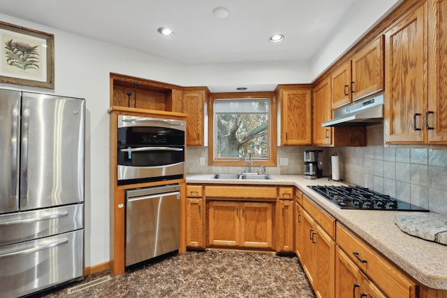 1412 10th Ave W, Shakopee, MN 55379 - kitchen with appliances with stainless steel finishes, a sink, brown cabinetry, light countertops, and recessed lighting