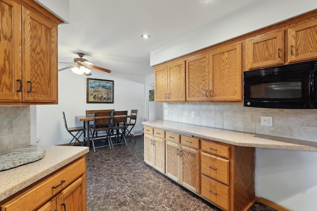 1412 10th Ave W, Shakopee, MN 55379 - kitchen with black microwave, a ceiling fan, tasteful backsplash, light countertops, and recessed lighting