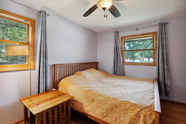 1412 10th Ave W, Shakopee, MN 55379 - bedroom featuring multiple windows, wood finished floors, baseboards, and a ceiling fan