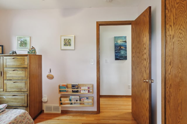1412 10th Ave W, Shakopee, MN 55379 - bedroom with light wood-style flooring and baseboards