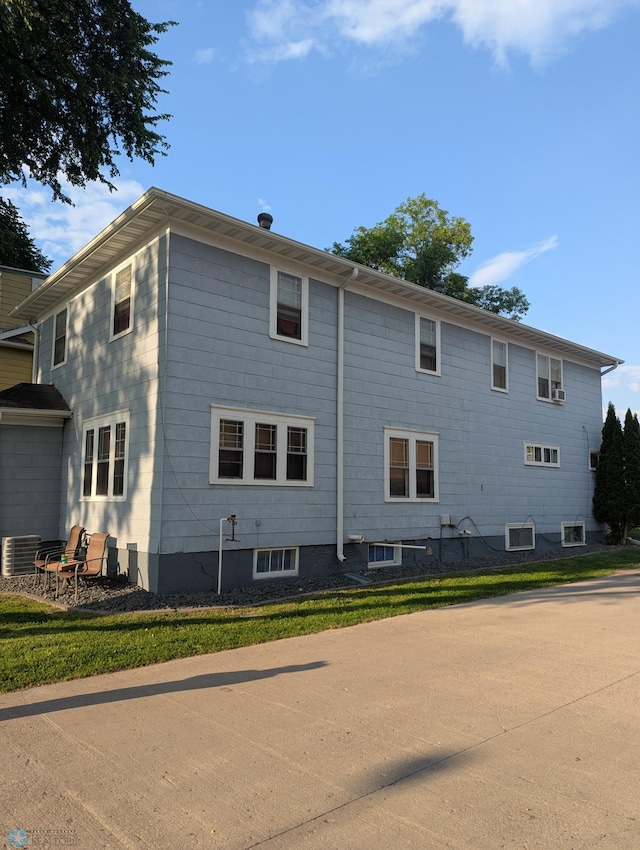 721 8th St N, Fargo, ND 58102 - rear view of house featuring central AC unit