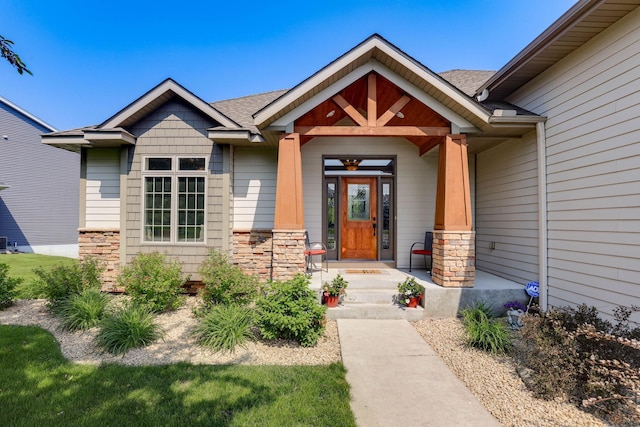 13478 Clearwater Cir, Rogers, MN 55374 - entrance to property with stone siding and a porch