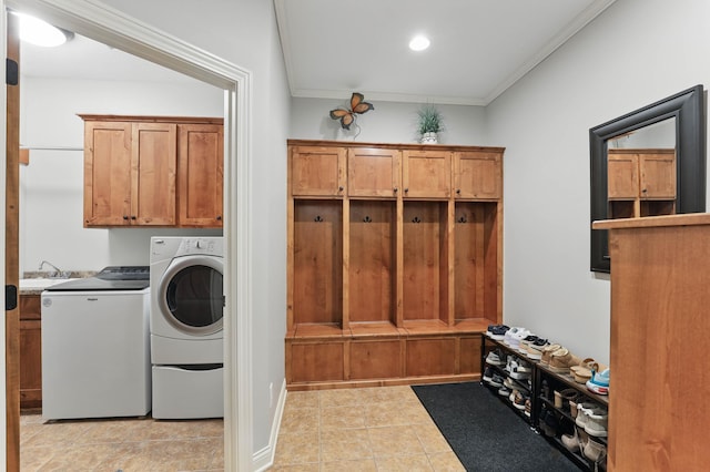 13478 Clearwater Cir, Rogers, MN 55374 - washroom featuring cabinet space, crown molding, light tile patterned floors, washing machine and dryer, and recessed lighting