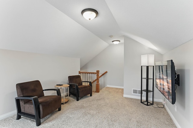 13478 Clearwater Cir, Rogers, MN 55374 - sitting room with lofted ceiling, carpet floors, and an upstairs landing
