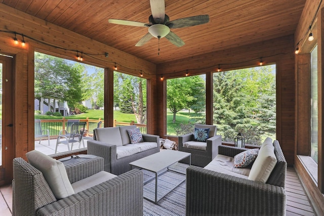 13478 Clearwater Cir, Rogers, MN 55374 - deck with an outdoor living space, a ceiling fan, and a lawn