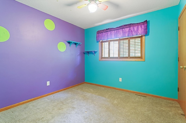 1580 9th Street Cir SE, Forest Lake, MN 55025 - spare room featuring a ceiling fan, carpet floors, and baseboards