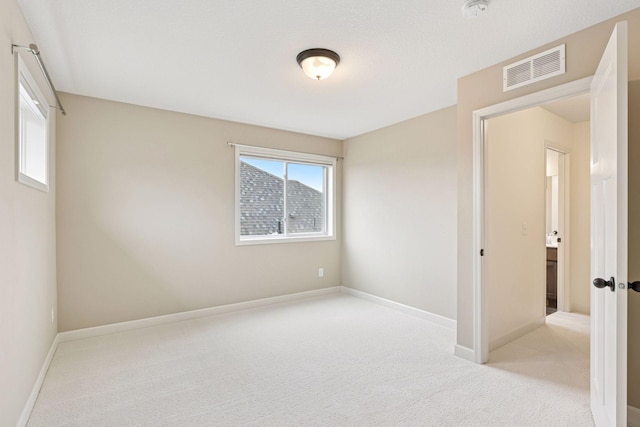5175 White Star Ln, Woodbury, MN 55129 - spare room with carpet, baseboards, and a smoke detector