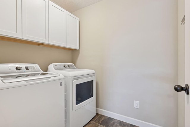 5175 White Star Ln, Woodbury, MN 55129 - laundry room with separate washer and dryer, cabinet space, and baseboards