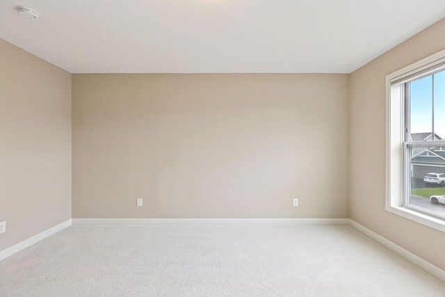 5175 White Star Ln, Woodbury, MN 55129 - carpeted empty room featuring a smoke detector and baseboards